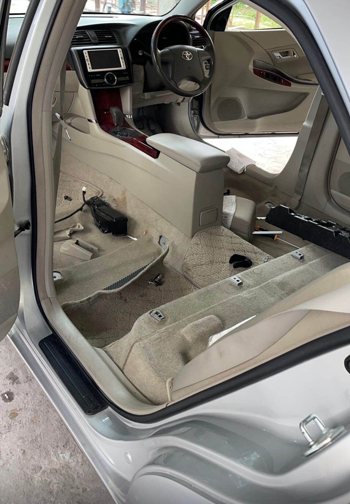 A car interior with the seats removed for a full extraction clean during a CDCS detailing service